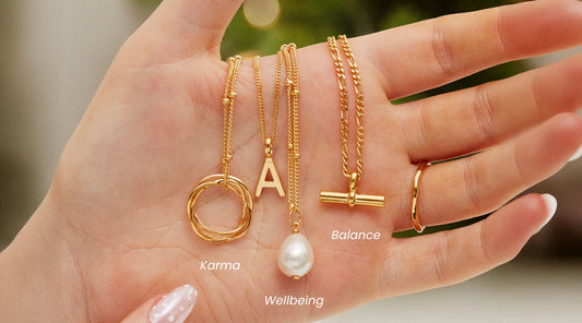 4 meaningful necklaces in the palm of the hand