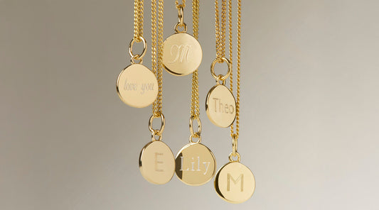 Selection of small gold personalised necklaces