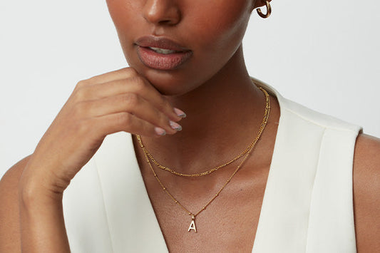 Lady wearing an initial necklace