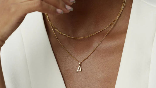 model wearing a letter a necklace
