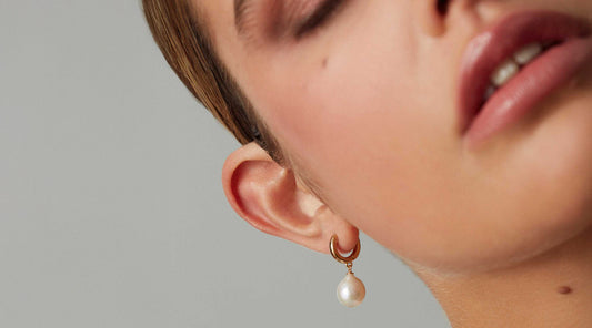 pearl hoop earrings in ear
